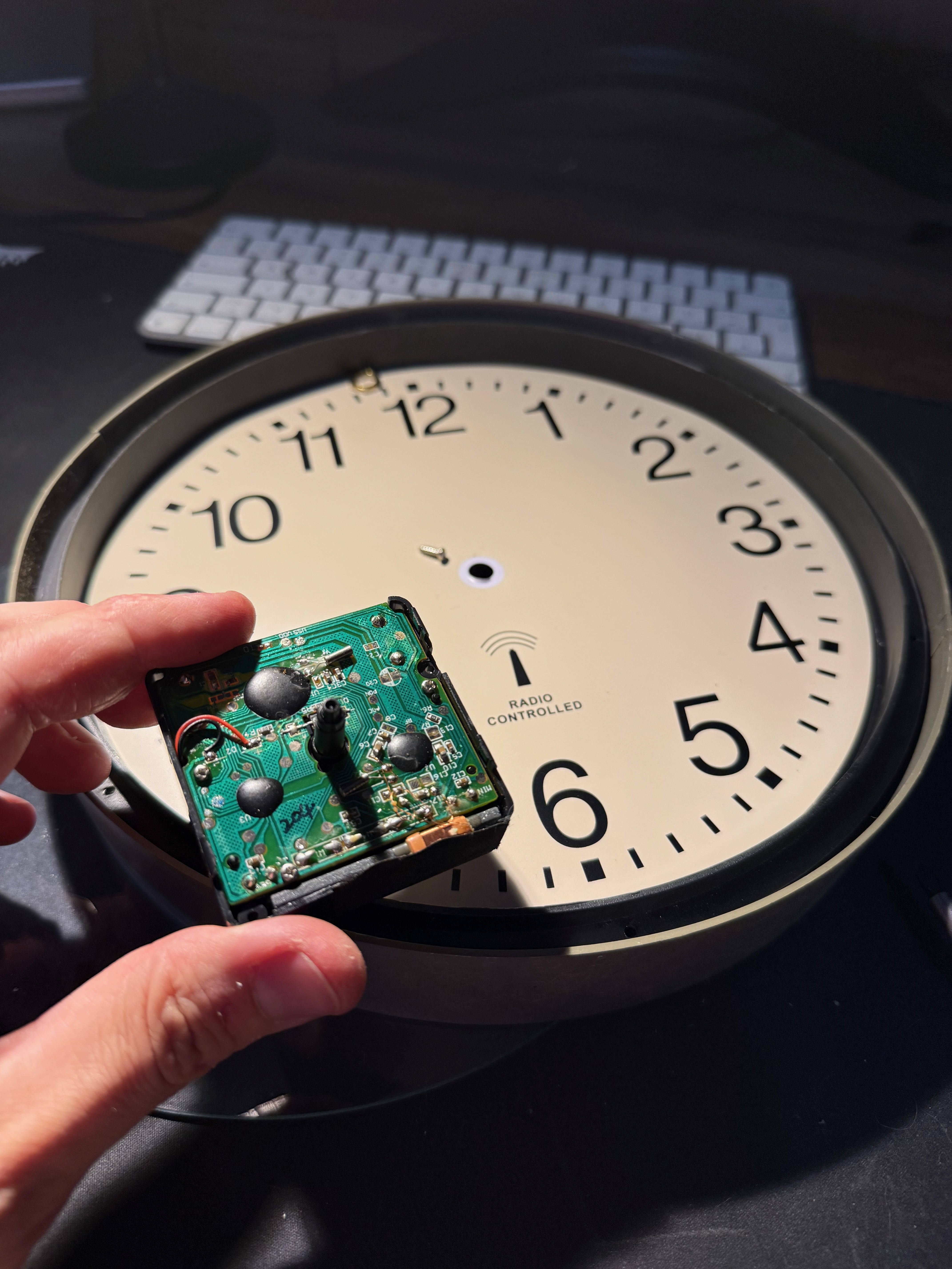 Cracking open a dead radio-controlled wall clock to extract the ferrite antenna