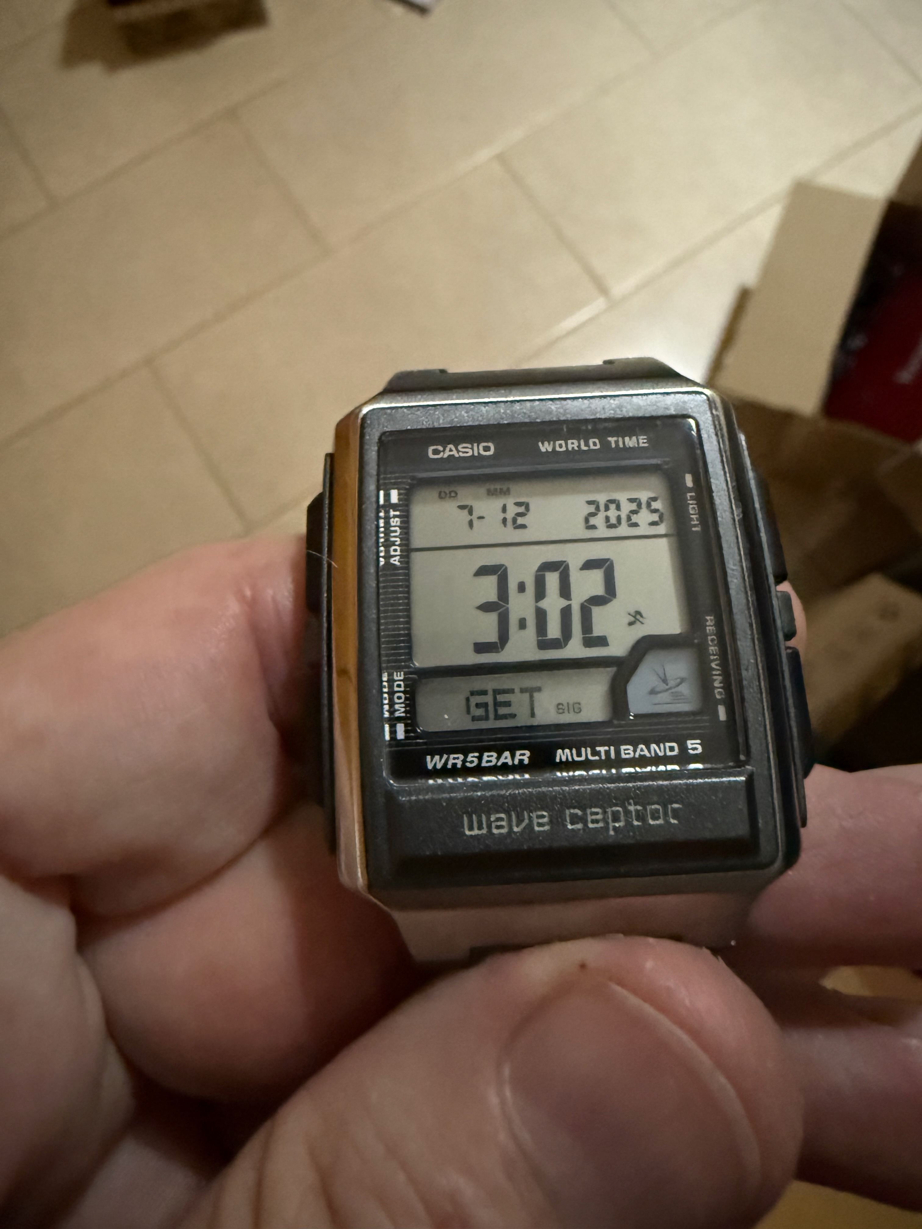 Casio Wave Ceptor displaying GET SIG at 3:02 AM on December 7, 2025