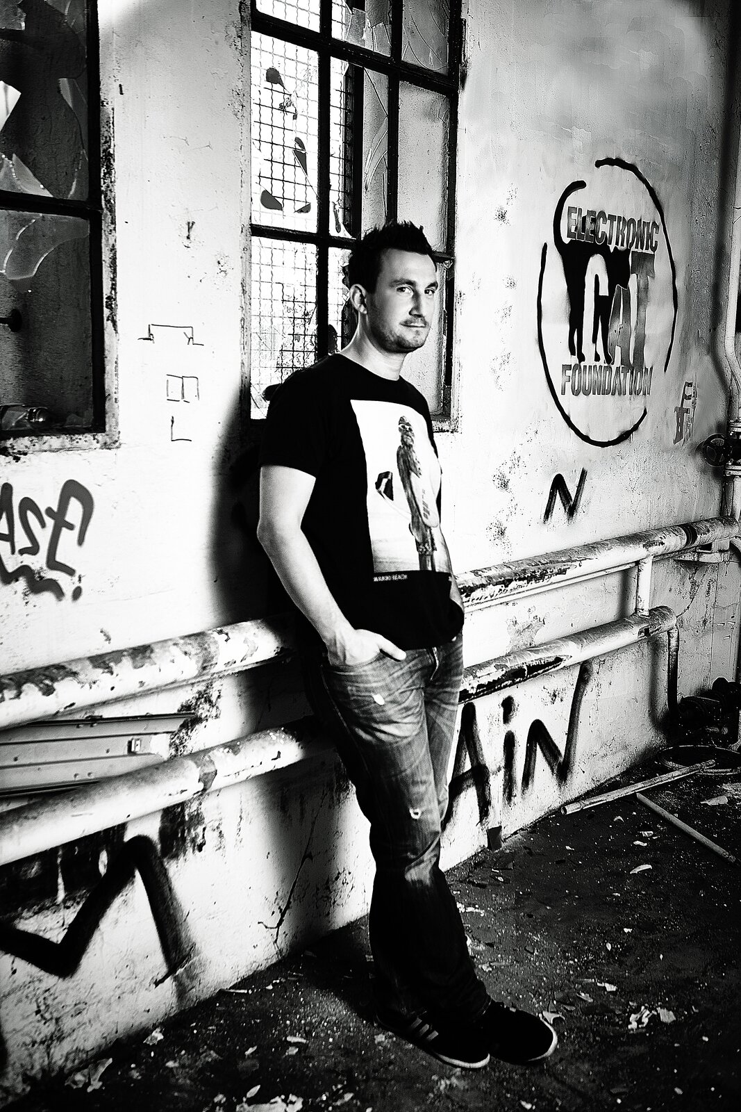 Electronic Cat Foundation artist promo — black and white, abandoned warehouse with ECF logo